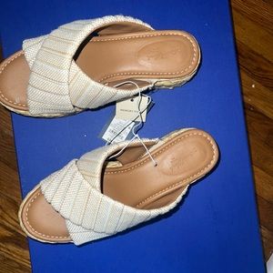 Woven sandals with tags